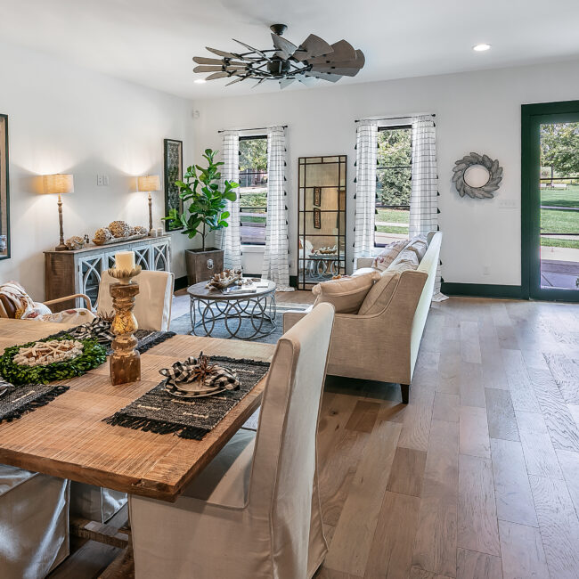Living room with sliding glass door to backyard in Urban Loft, a custom home by Mike Stevens Homes