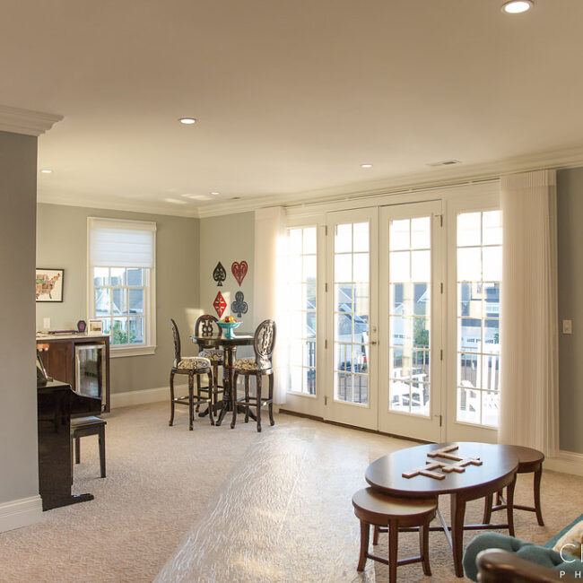 Breakfast nook with French doors and bistro stools in Haunted Mansion Homage, a custom home by Mike Stevens Homes