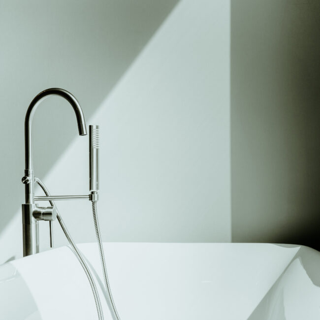 Freestanding tub with floor-mount faucet in Timeless Charm, a custom home by Mike Stevens Homes