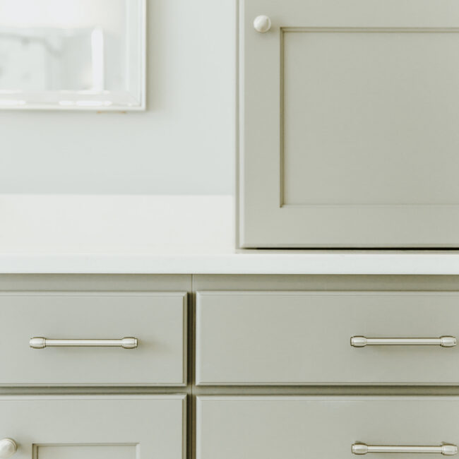 Vanity drawers with brushed nickel bar pulls in Timeless Charm, a custom home by Mike Stevens Homes