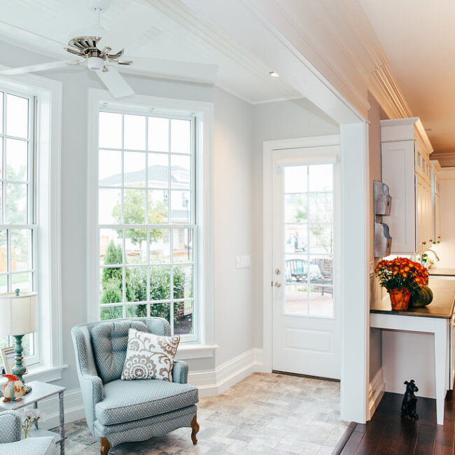 Breakfast area with door to back porch and fall flowers in Haunted Mansion Homage, a custom home by Mike Stevens Homes