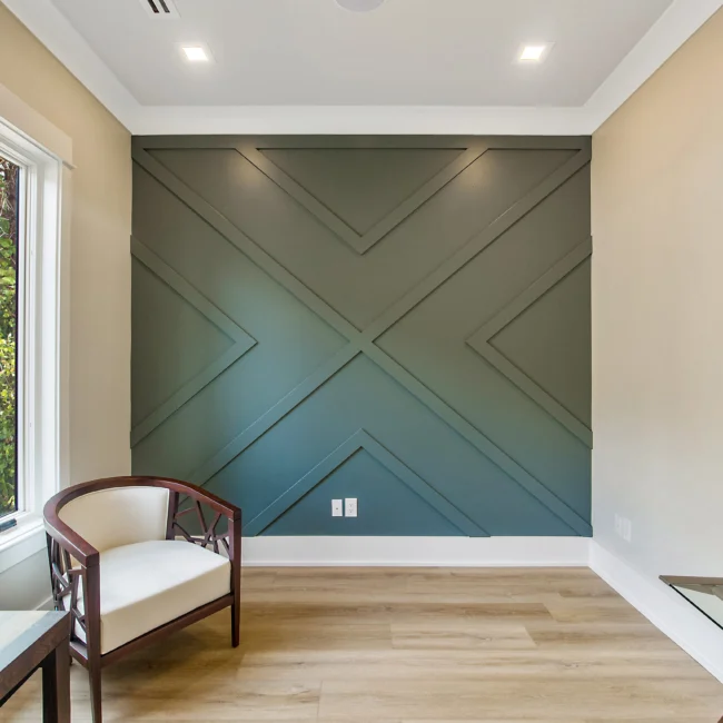 Accent wall with geometric green panel molding in Contemporary Luxury, a custom home by Mike Stevens Homes