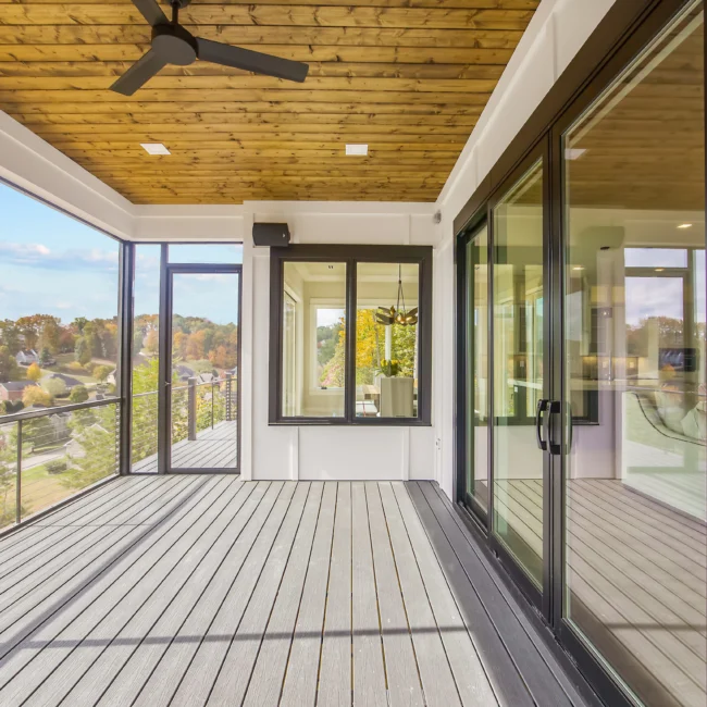 Covered deck with wood ceiling and sliding glass doors in Contemporary Luxury, a custom home by Mike Stevens Homes