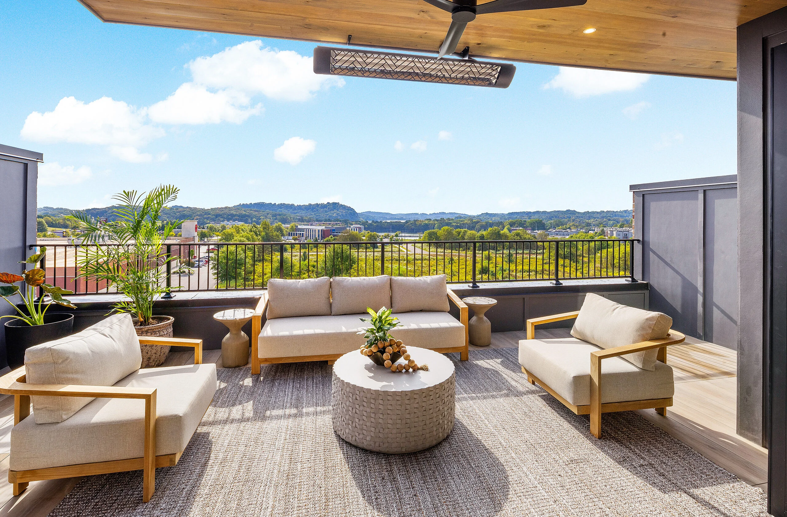 Rooftop terrace with lounge seating and hill views in The Overlook by Mike Stevens Homes
