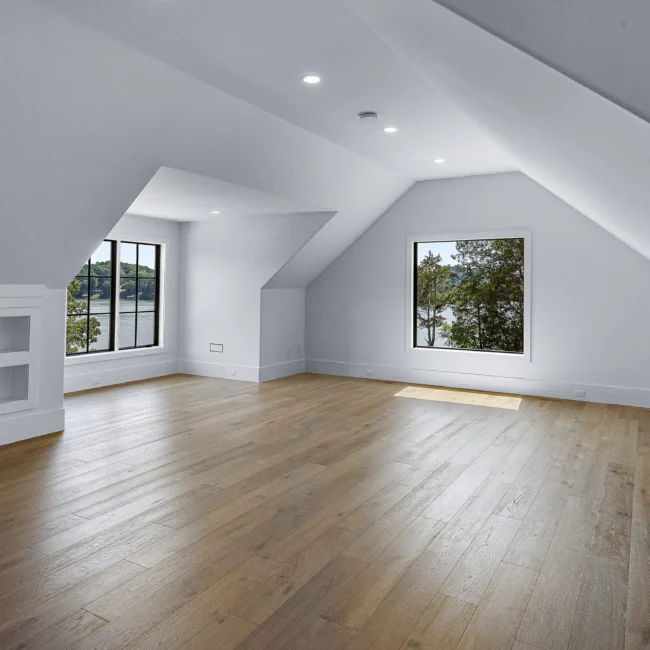 Bonus room with dormer windows and angled ceilings in Edgewater Estate, a custom home by Mike Stevens Homes