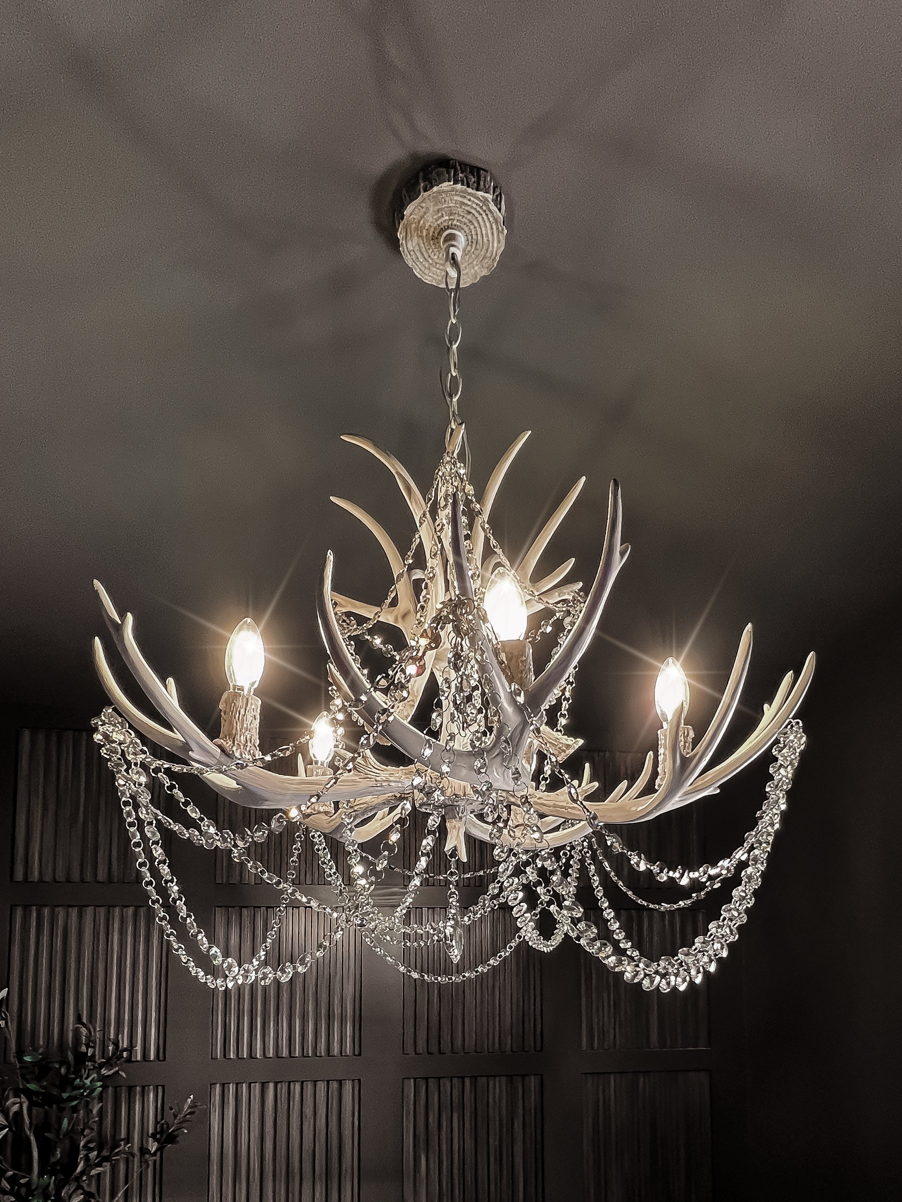 A statement antler chandelier in a Mike Stevens Homes interior