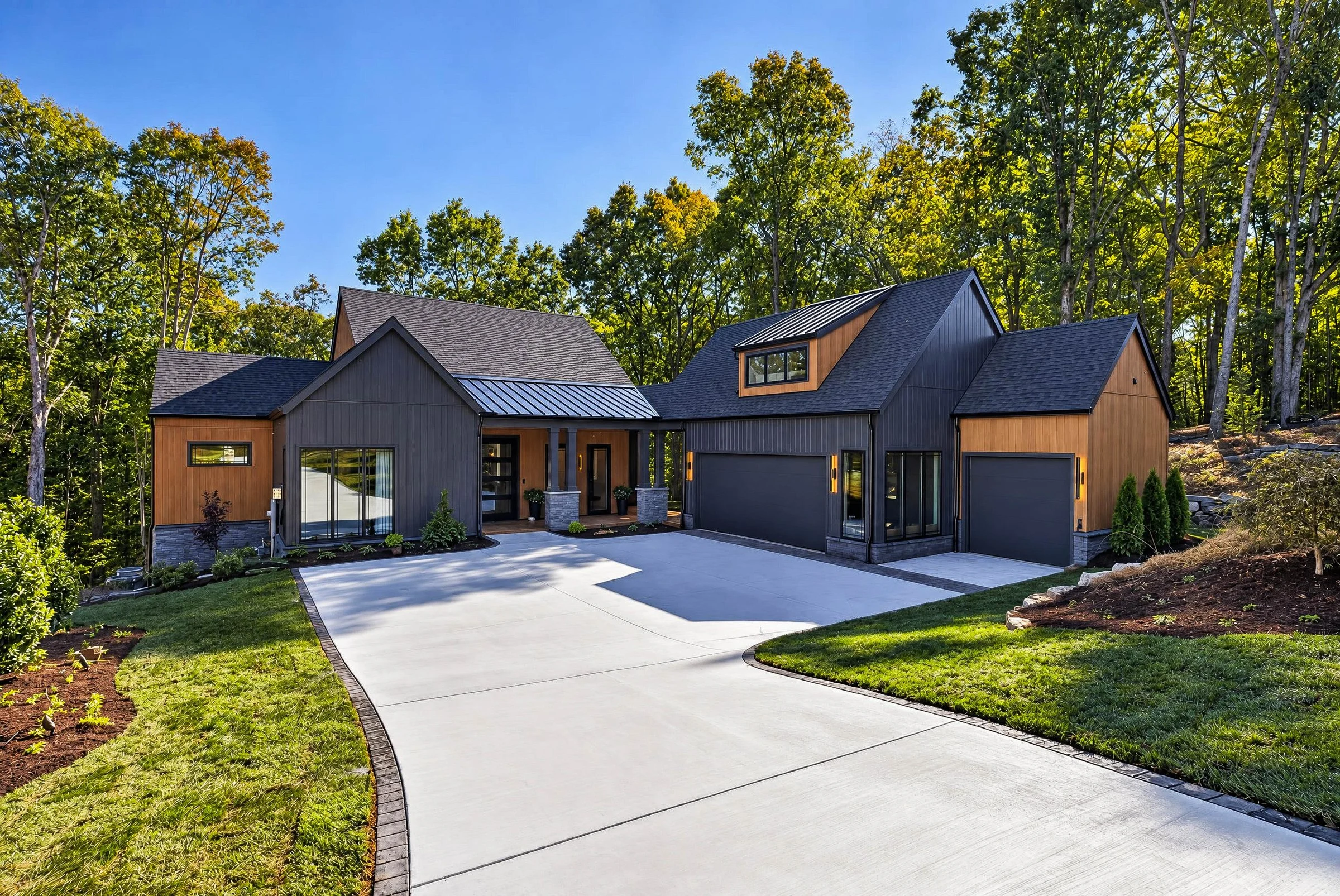 Dark board-and-batten exterior in Shino No Mori, a custom home in Tennessee National, Loudon, TN by Mike Stevens Homes.